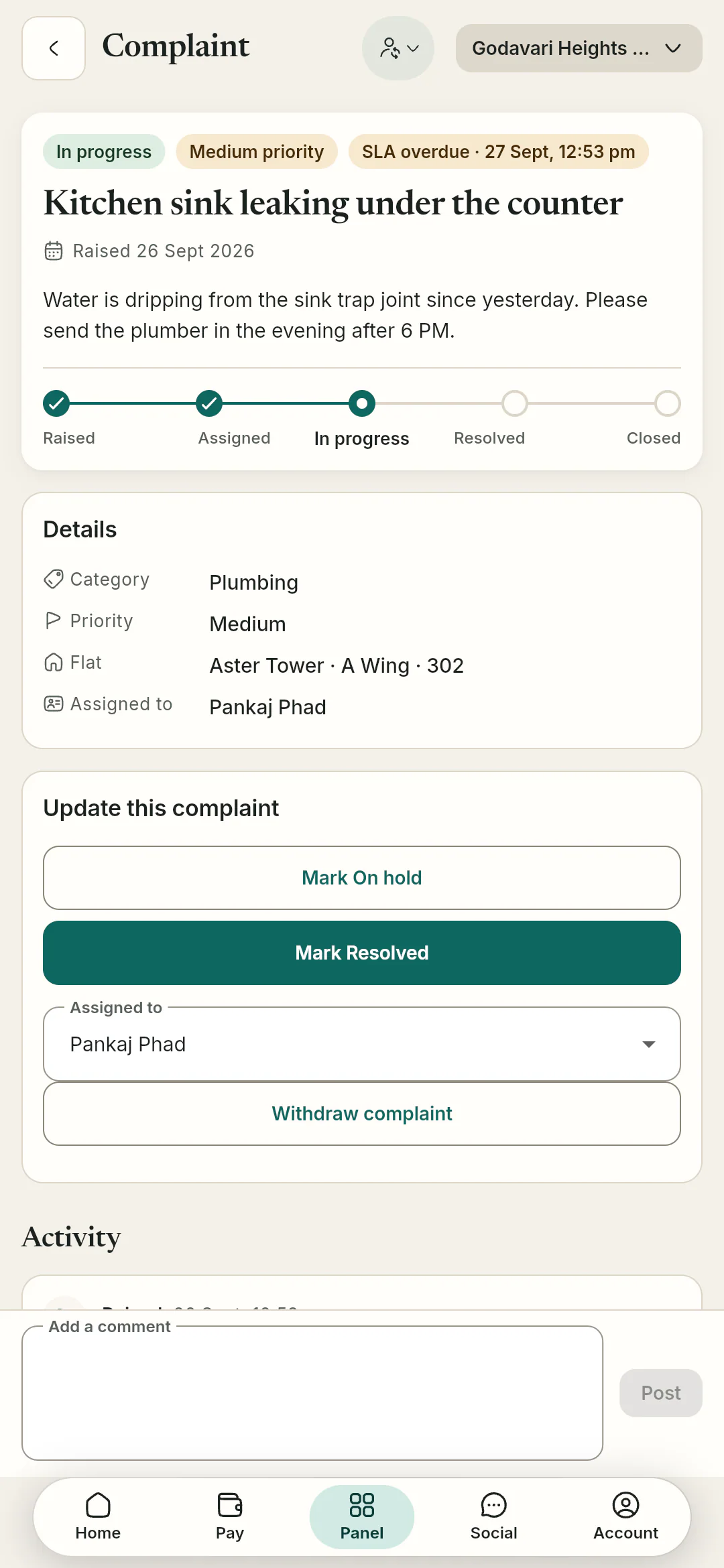 The complaint thread shows who it is assigned to and updates from the committee, and residents can reply.